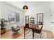 Well-lit home office with a modern desk, chair, and large window at 1912 St John St, Charlotte, NC 28216