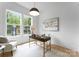 Bright office space with large windows, modern desk, and stylish decor is perfect for a productive work environment at 1912 St John St, Charlotte, NC 28216
