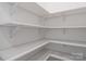 Pantry with white shelves offering ample storage space for food and kitchen essentials at 1912 St John St, Charlotte, NC 28216