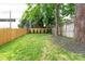 Private backyard with a wooden fence and lush lawn at 1920 Hamorton Pl, Charlotte, NC 28205