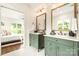 Elegant bathroom with double vanity, marble countertops, and a view of the bedroom at 1920 Hamorton Pl, Charlotte, NC 28205