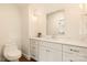 Modern bathroom with white cabinets and marble countertop at 1920 Hamorton Pl, Charlotte, NC 28205