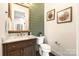 Powder room with green shiplap and marble vanity at 1920 Hamorton Pl, Charlotte, NC 28205