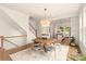 Open concept dining room with a wooden table and kitchen view at 1920 Hamorton Pl, Charlotte, NC 28205