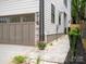 Two-car garage with modern door and walkway at 1920 Hamorton Pl, Charlotte, NC 28205