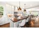 Gourmet kitchen boasts a large island, stainless steel appliances, and white cabinetry at 1920 Hamorton Pl, Charlotte, NC 28205