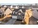 An aerial view of the home complete with an attached garage and a meticulously maintained lawn at 2025 Killian Creek Dr, Denver, NC 28037