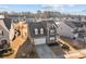 An aerial view of the home complete with an attached garage and a meticulously maintained lawn at 2025 Killian Creek Dr, Denver, NC 28037