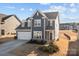 Beautiful two-story home boasts a well-kept lawn and a welcoming front entrance, perfect for new homeowners at 2025 Killian Creek Dr, Denver, NC 28037