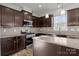 The kitchen features an island and is equipped with stainless steel appliances at 2025 Killian Creek Dr, Denver, NC 28037