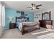 The main bedroom offers ample natural light, ceiling fan, and stylish matching furniture at 2025 Killian Creek Dr, Denver, NC 28037