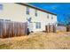 Townhouse backyard with wooden fence, patio, and satellite dishes at 217 22Nd Sw St # H, Hickory, NC 28602