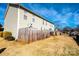 Townhouse backyard with wooden fence, patio, and satellite dishes at 217 22Nd Sw St # H, Hickory, NC 28602