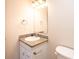 Small bathroom with granite countertop and white vanity at 217 22Nd Sw St # H, Hickory, NC 28602