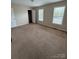 Spacious carpeted bedroom with two windows and a large closet at 217 22Nd Sw St # H, Hickory, NC 28602