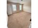 Carpeted bedroom with two windows and a door at 217 22Nd Sw St # H, Hickory, NC 28602