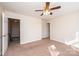 Upstairs bedroom with carpeted floor and ceiling fan at 217 22Nd Sw St # H, Hickory, NC 28602