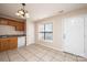 Kitchen with wood cabinets, granite countertop and tile floor at 217 22Nd Sw St # H, Hickory, NC 28602