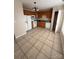 Kitchen with wood cabinets, white appliances, and tile floor at 217 22Nd Sw St # H, Hickory, NC 28602