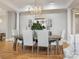 Formal dining room with hardwood floors and a large chandelier at 2223 Croydon Rd # 103, Charlotte, NC 28207