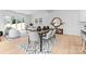 Dining area with wooden table, gray chairs, and a stylish rug at 2234 Revolution Park Dr, Charlotte, NC 28208