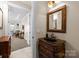 Elegant bathroom with dark vanity and granite countertop at 237 Wilson Lake Rd, Mooresville, NC 28117