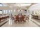 Bright dining room with lake views, a large table and access to other areas at 237 Wilson Lake Rd, Mooresville, NC 28117