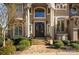 Elegant entryway with double doors, stone path, and landscaping at 237 Wilson Lake Rd, Mooresville, NC 28117