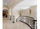 Open hallway with curved staircase and ornate railing at 237 Wilson Lake Rd, Mooresville, NC 28117