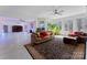 Bright living room featuring large windows, modern ceiling fan, and open floor plan at 237 Wilson Lake Rd, Mooresville, NC 28117