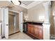 Convenient wet bar with granite countertop and cabinetry at 237 Wilson Lake Rd, Mooresville, NC 28117