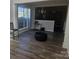 Bright dining area with hardwood floors and large window at 2409 Deberry Ct, Charlotte, NC 28213