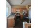 Kitchen with stainless steel appliances and wood cabinets at 2409 Deberry Ct, Charlotte, NC 28213