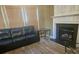 Living room features a fireplace and hardwood floors at 2409 Deberry Ct, Charlotte, NC 28213