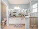 Double vanity bathroom with granite counters and large mirror at 245 Sweet Briar Dr, Fort Mill, SC 29707