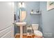 Powder room with pedestal sink and updated fixtures at 245 Sweet Briar Dr, Fort Mill, SC 29707