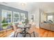 Charming dining area with a round table and four chairs, near a door to the backyard at 245 Sweet Briar Dr, Fort Mill, SC 29707