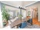 Open dining room with hardwood floors and a farmhouse table at 245 Sweet Briar Dr, Fort Mill, SC 29707