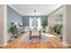 Open dining room with hardwood floors and a farmhouse table at 245 Sweet Briar Dr, Fort Mill, SC 29707