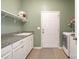 Bright laundry room with washer, dryer, and storage at 245 Sweet Briar Dr, Fort Mill, SC 29707