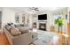 Bright living room with a cozy fireplace and large windows at 245 Sweet Briar Dr, Fort Mill, SC 29707