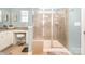 Large walk-in shower with tiled walls and a built-in seat at 245 Sweet Briar Dr, Fort Mill, SC 29707