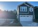 Two-story home with gray siding, white trim, and two-car garage at 284 Laura Elizabeth Ln, Clover, SC 29710