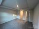 Main bedroom with carpet, tray ceiling, and ensuite bathroom at 284 Laura Elizabeth Ln, Clover, SC 29710