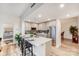 Bright kitchen featuring an island with barstool seating, stainless steel appliances and unique backsplash at 315 Arlington Ave # 607, Charlotte, NC 28203