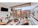 Bright living room with large windows, neutral colors, and balcony access at 315 Arlington Ave # 607, Charlotte, NC 28203