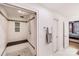 Walk-in shower with subway tile, a built-in bench, and glass enclosure at 315 Arlington Ave # 607, Charlotte, NC 28203