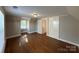 Hardwood floor bedroom with access to hallway and bath at 330 E Main St, Albemarle, NC 28001