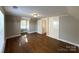 An attic bedroom offers a cozy and private retreat with hardwood floors at 330 E Main St, Albemarle, NC 28001