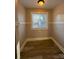 Bright dining area with wood flooring and a window at 330 E Main St, Albemarle, NC 28001